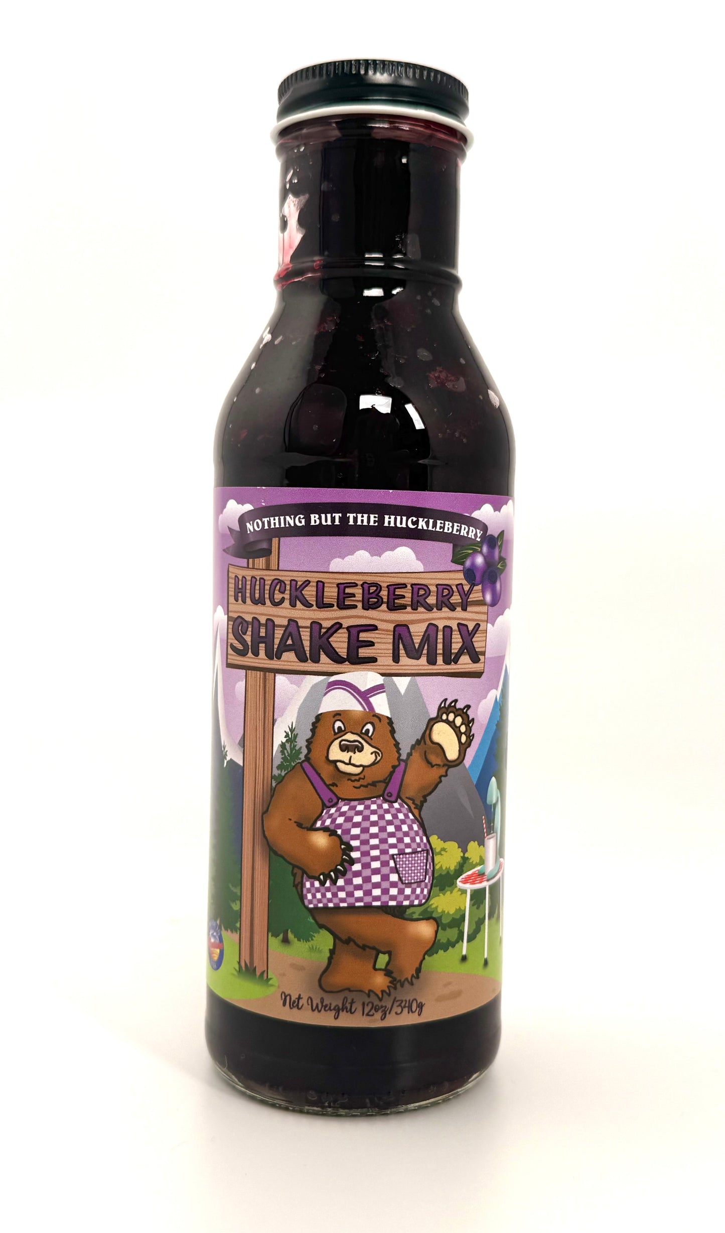 Bottle of huckleberry shake mix, purple berry-flavored drink sauce