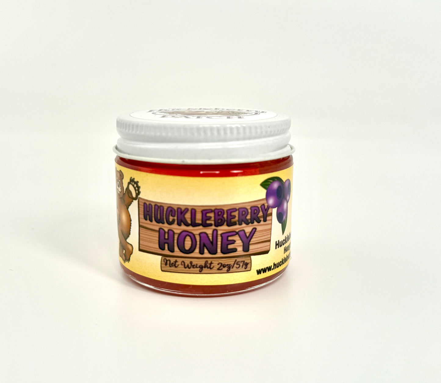 Jar of golden huckleberry honey with bear label