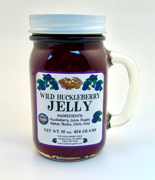 Large 16oz jar of huckleberry jelly with smooth texture and rich hue