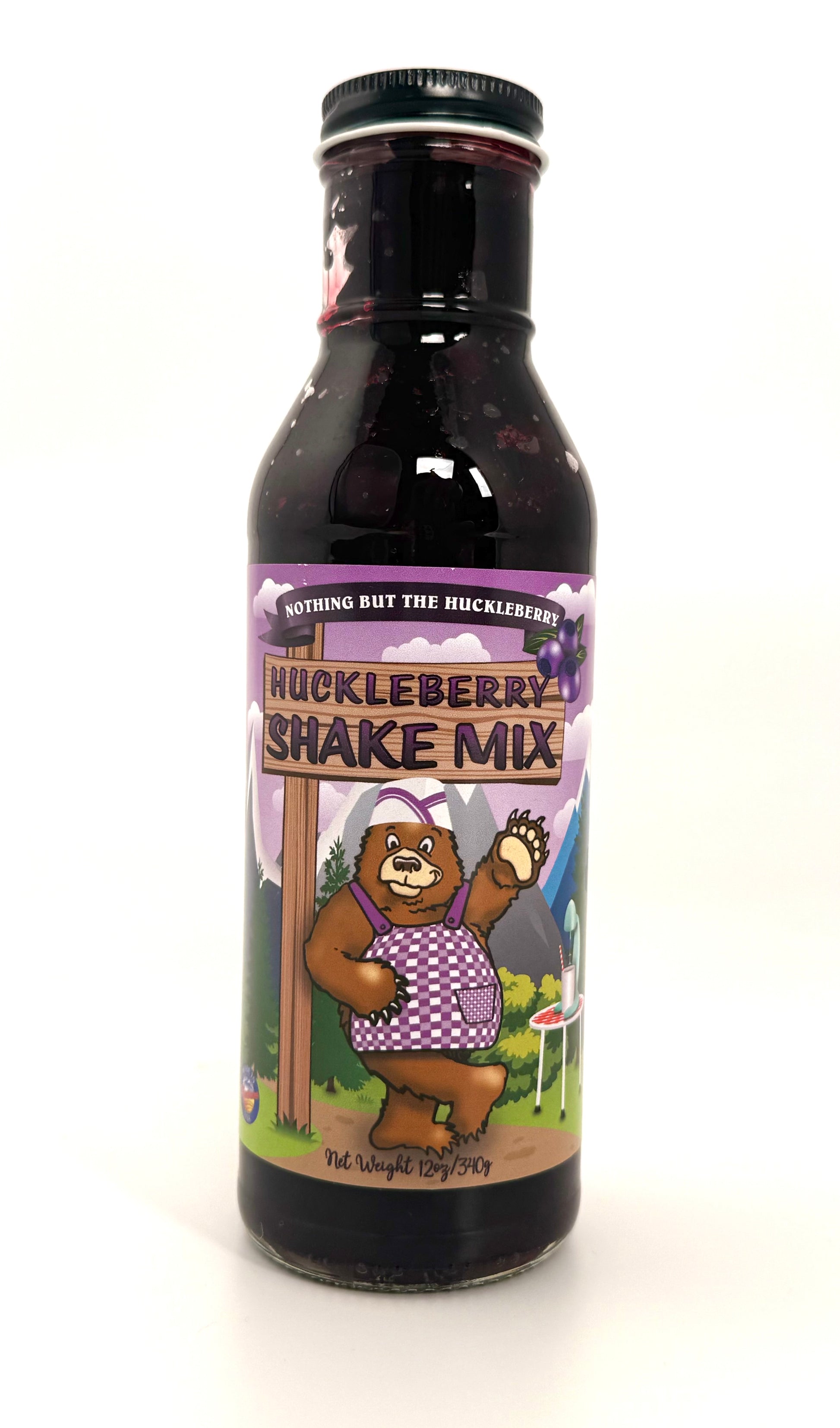 Bottle of huckleberry shake mix, purple berry-flavored drink sauce