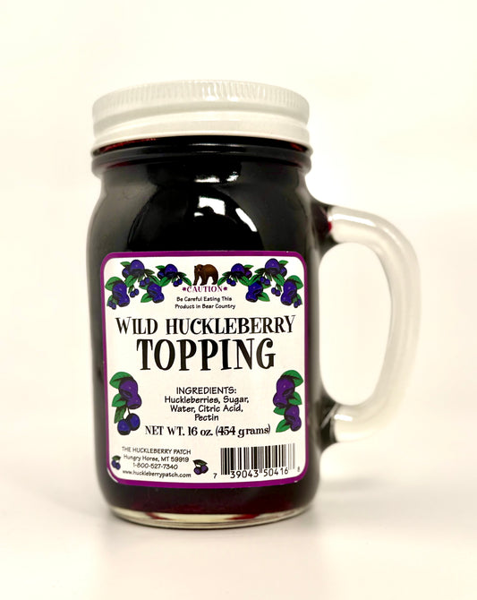 Large 16oz jar of huckleberry topping with berry-filled contents visible