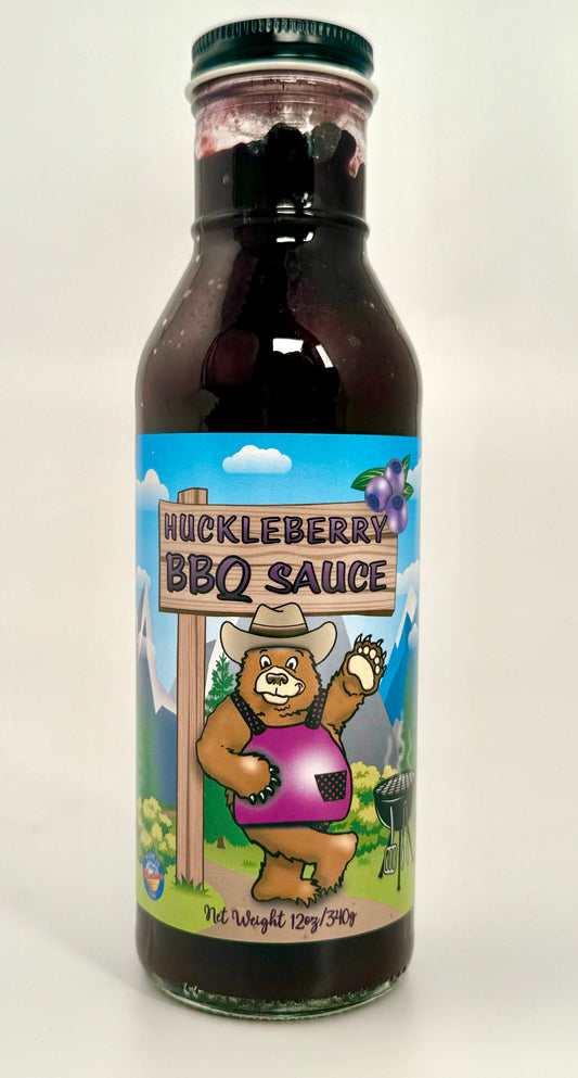 Sweet Smokey huckleberry sauce in glass bottle